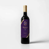Tastefully Olive Blueberry dark balsamic bottle with a purple label and gold cap on a white background.