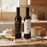 Tastefully Olive Vegan Butter olive oil and Cranberry Pear white balsamic bottles with bread, sliced pears, cranberries, and a dipping bowl.