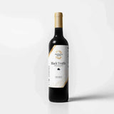 Tastefully Olive Black Truffle white balsamic vinegar bottle with a white label and gold cap on a white background.