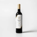 Tastefully Olive Cranberry Pear white balsamic vinegar bottle with a white label and gold cap on a white background.