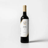 Tastefully Olive Greek Seasoning white balsamic vinegar bottle with a white label and gold cap on a white background.